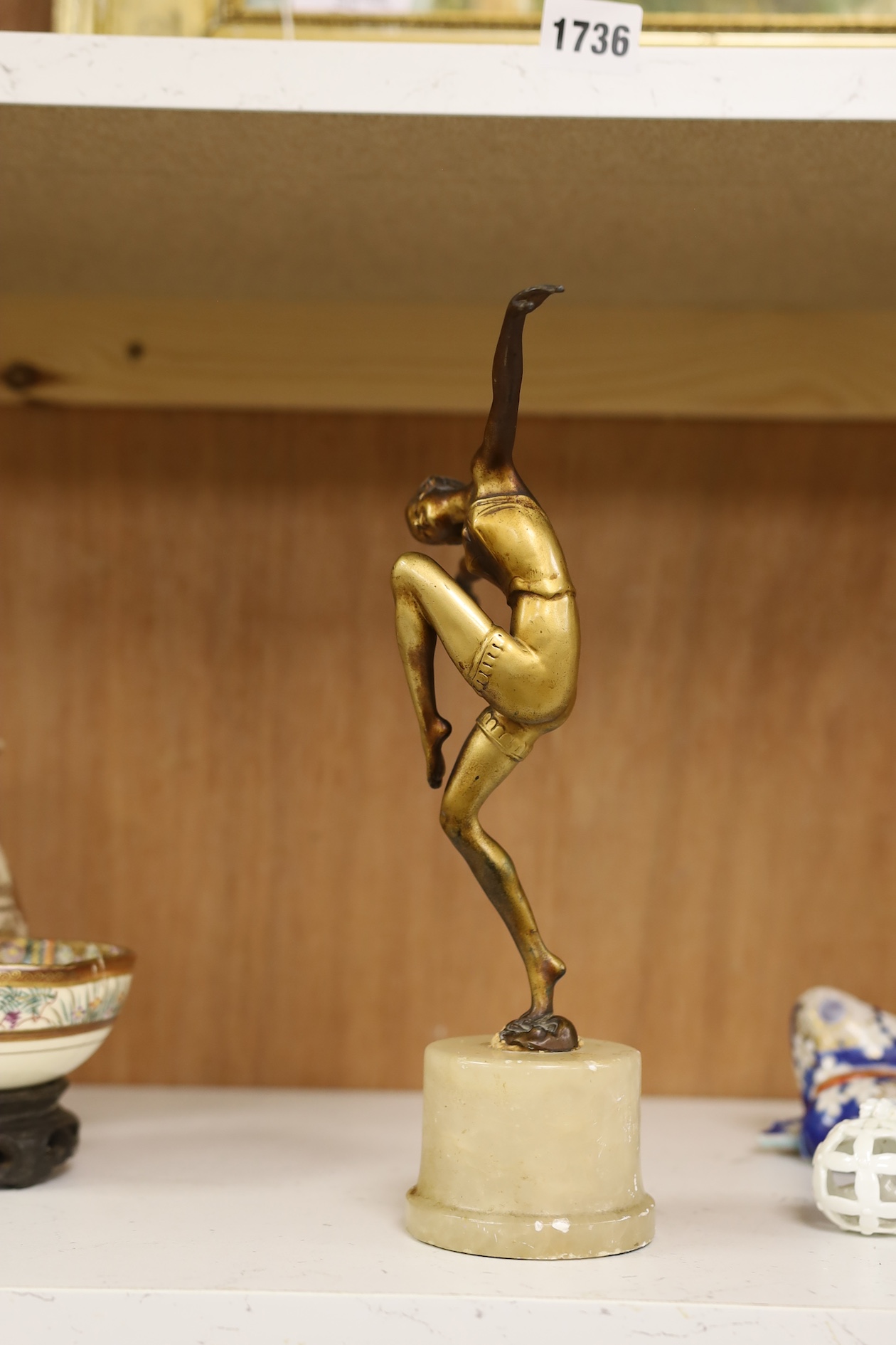 A gilt patinated spelter dancing figure after Chiparus, 27cm high. Condition - front of base of figure at the feet broken